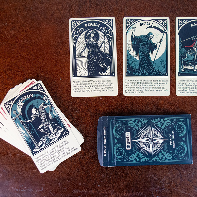 Photo of a stack of cards on the left with the Donjon card on top and three cards on top including the rogue, skull and knight cards.