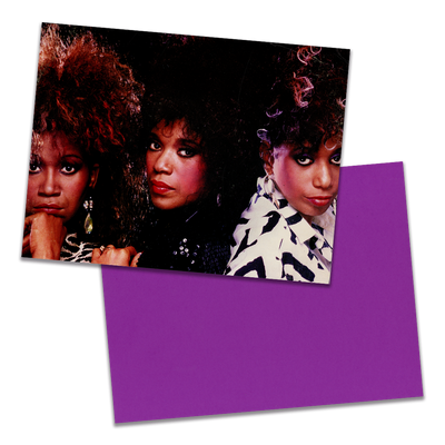 Photo of a 11” x 8.5” notebook cover made from an upcycled Pointer Sisters "Dare Me" album sleeve and the back cover with coral cardstock on a transparent background.