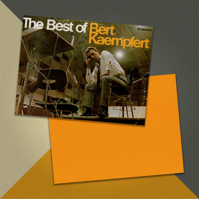 Photo of a 11” x 8.5” notebook cover made from an upcycled Bert Kaempfert "The Best Of Bert Kaempfert" album sleeve and the back cover with orangecardstock on an orange, cream and grey background.