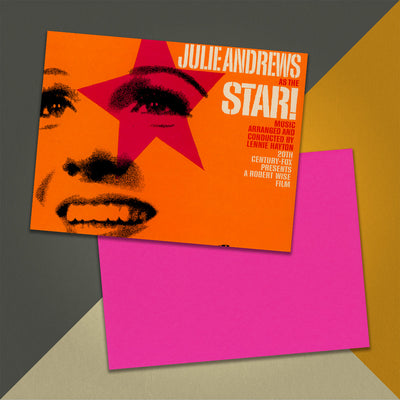 Photo of a 11” x 8.5” notebook cover made from an upcycled Julie Andrews "Star! (Original Motion Picture Sound Track Album)!" album sleeve and the back cover with coral cardstock on an orange, cream and grey background.