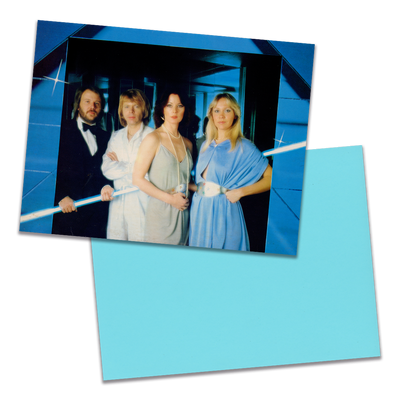 Photo of a 11” x 8.5” notebook cover made from an upcycled ABBA "Voulez-Vous!" album sleeve and the back cover with light blue cardstock on a transparent background.