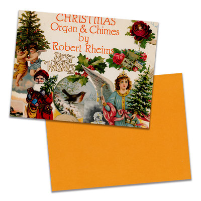 Photo of a 11” x 8.5” notebook cover made from an upcycled Robert Rheims "Christmas Organ & Chimes By Robert Rheims" album sleeve and the back cover with orange cardstock on a transparent background.