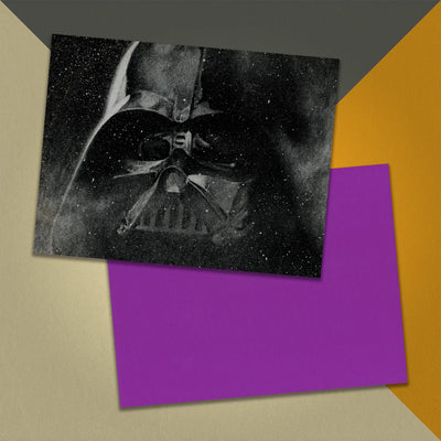 Photo of a 11” x 8.5” notebook cover made from an upcycledJohn Williams & the London Symphony Orchestra "Star Wars" album sleeve and the back cover with purple cardstock on an orange, cream and grey background.