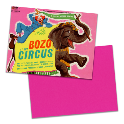 Photo of a 11” x 8.5” notebook cover made from an upcycled Pinto Colvig, Billy May “Bozo At The Circus” album sleeve and the back cover with hot pink cardstock on a transparent background.