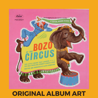 Photo of the cover of the Pinto Colvig, Billy May “Bozo At The Circus” album sleeve with the text “Original Album Art” on an orange border around the photo.