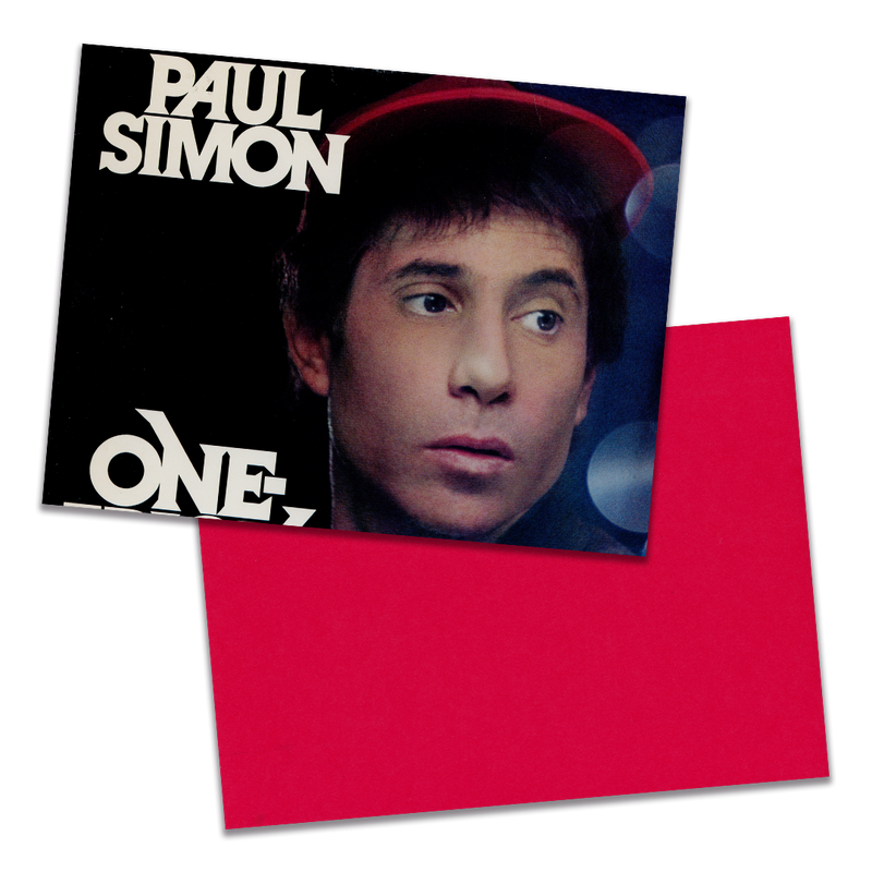 Photo of a 11” x 8.5” notebook cover made from an upcycled Paul Simon “One Trick Pony” album sleeve and the back cover with red cardstock on a transparent background.