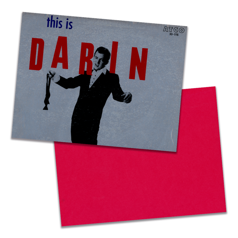 Photo of a 11” x 8.5” notebook cover made from an upcycled Bobby Darin “This is Darin” album sleeve and the back cover with red cardstock on a transparent background.