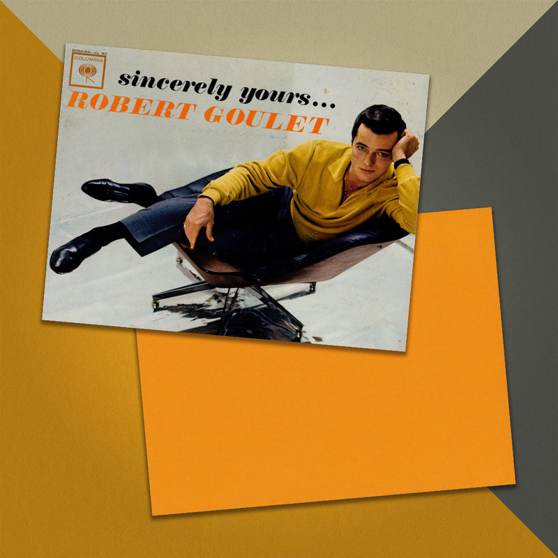 Photo of a 11” x 8.5” notebook cover made from an upcycled Robert Goulet “Sincerely Yours...” album sleeve and the back cover with orange cardstock on an orange, cream and grey background.