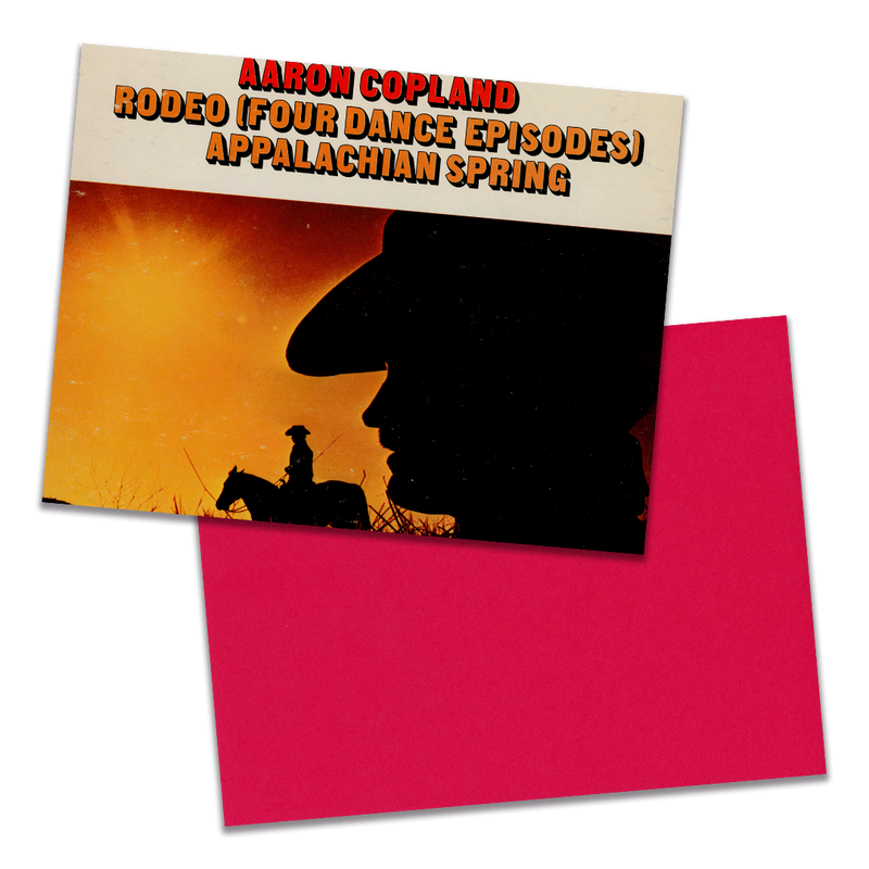 Photo of a 11” x 8.5” notebook cover made from an upcycled Aaron Copland “Great American Ballets, Vol. 2” album sleeve and the back cover with red cardstock on a transparent background.