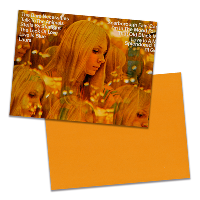 Photo of a 11” x 8.5” notebook cover made from an upcycled Andre Kostelanetz And His Orchestra “Scarborough Fair And Other Great Movie Hits” album sleeve and the back cover with orange cardstock on a transparent background.