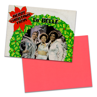 Photo of a 11” x 8.5” notebook cover made from an upcycled LaBelle & The Bluebelles “Merry Christmas From LaBelle & The Bluebelles” album sleeve and the back cover with coral cardstock on a transparent  background.