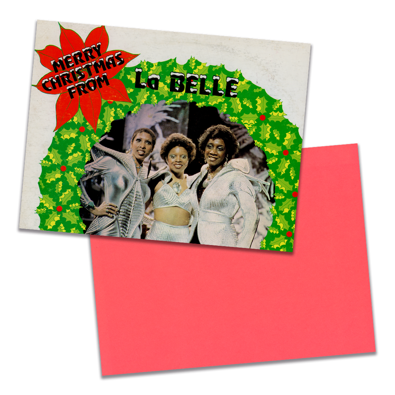 Photo of a 11” x 8.5” notebook cover made from an upcycled LaBelle & The Bluebelles “Merry Christmas From LaBelle & The Bluebelles” album sleeve and the back cover with coral cardstock on a transparent  background.