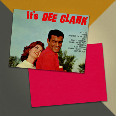 Photo of a 11” x 8.5” notebook cover made from an upcycled Dee Clark “Hold On....It’s Dee Clark” album sleeve and the back cover with red cardstock on an orange, cream and grey background.