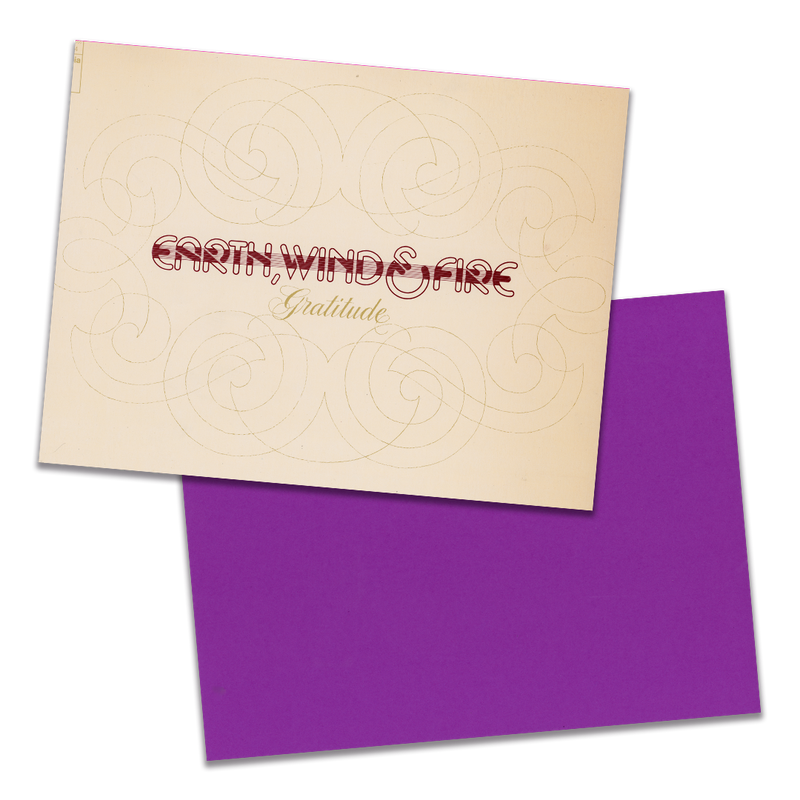 Photo of a 11” x 8.5” notebook cover made from an upcycled Earth, Wind & Fire “Gratitude” album sleeve and the back cover with purple cardstock on a transparent background.