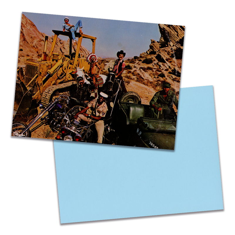 Photo of a 11” x 8.5” notebook cover made from an upcycled Village People “Cruisin’” album sleeve and the back cover with light blue cardstock on a transparent background.