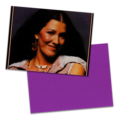 Photo of a 11” x 8.5” notebook cover made from an upcycled Rita Coolidge “Anytime... Anywhere” album sleeve and the back cover with purple cardstock on a transparent background.