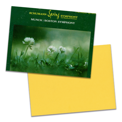 Photo of a 11” x 8.5” notebook cover made from an upcycled Schumann : Munch / Boston Symphony “Spring Symphony And Manfred Overture” album sleeve and the back cover with yellow cardstock on a transparent background.