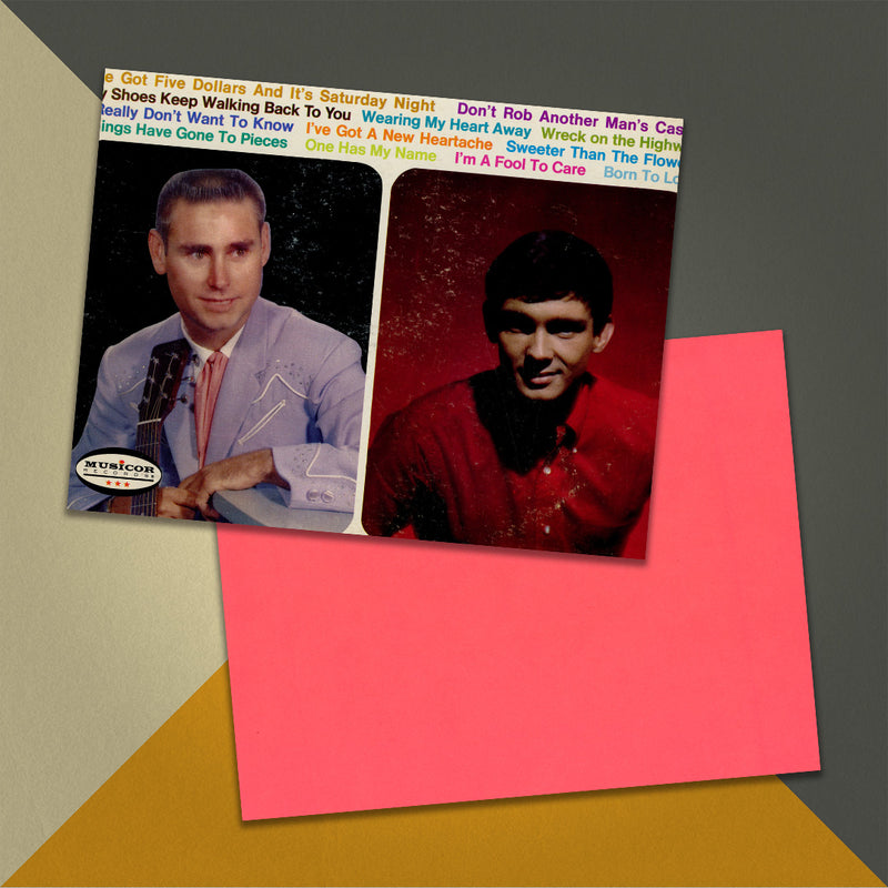 Photo of a 11” x 8.5” notebook cover made from an upcycled George Jones, Gene Pitney “George Jones & Gene Pitney” album sleeve and the back cover with coral cardstock on an orange, cream and grey background.