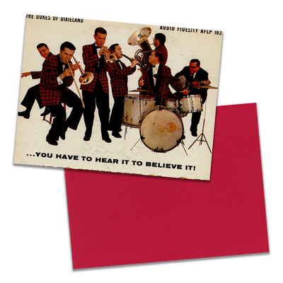 Photo of a 11” x 8.5” notebook cover made from an upcycled The Dukes Of Dixieland “You Have To Hear It To Believe It!” album sleeve and the back cover with red cardstock on a transparent background.