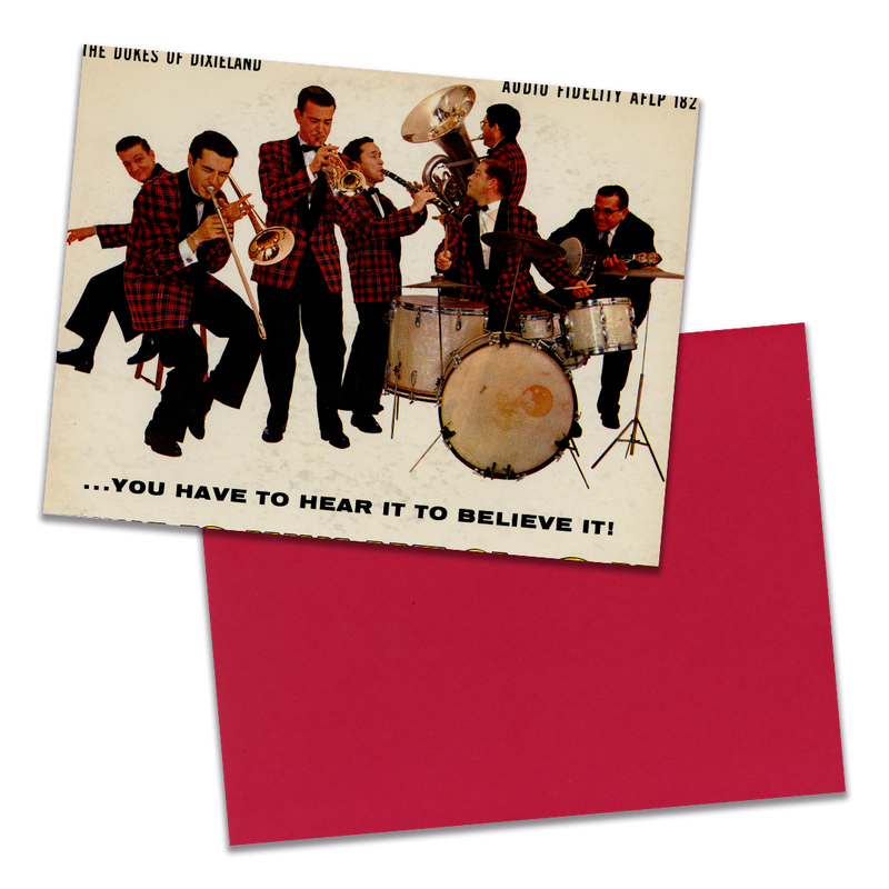 Photo of a 11” x 8.5” notebook cover made from an upcycled The Dukes Of Dixieland “You Have To Hear It To Believe It!” album sleeve and the back cover with red cardstock on a transparent background.