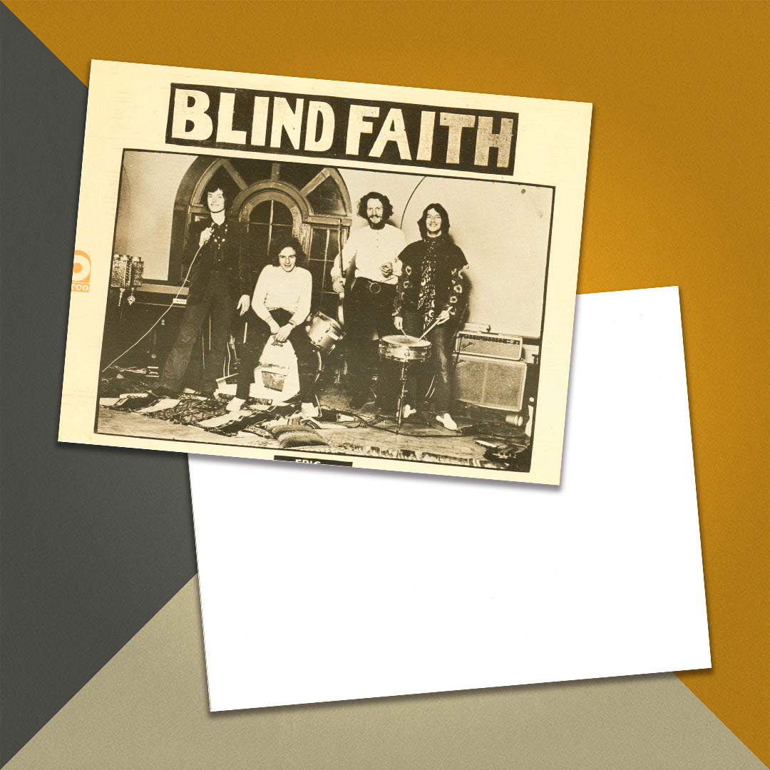 Photo of a 11” x 8.5” notebook cover made from an upcycled Blind Faith "Blind Faith" album sleeve and the back cover with white cardstock on an orange, cream and grey background.