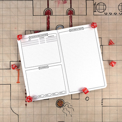 Second and third pages of the barbarian notebook with areas for tracking attacks & spellcasting and equipment on the right and a ruled sheet for features & traits on the right. The notebook sits on a grid map surrounded by dice.