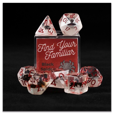 A set of clear and cloudy polyhedral dice with black spider inclusions sitting on top and around a small acrylic box with the words "Find Your Familiar" and "Black Spider Dice Set" on a transparent background.