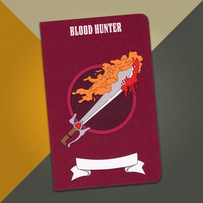 A large blood hunter notebook with a dark red cover and an illustration of a flaming sword with blood on the tip on an orange, cream and grey background.