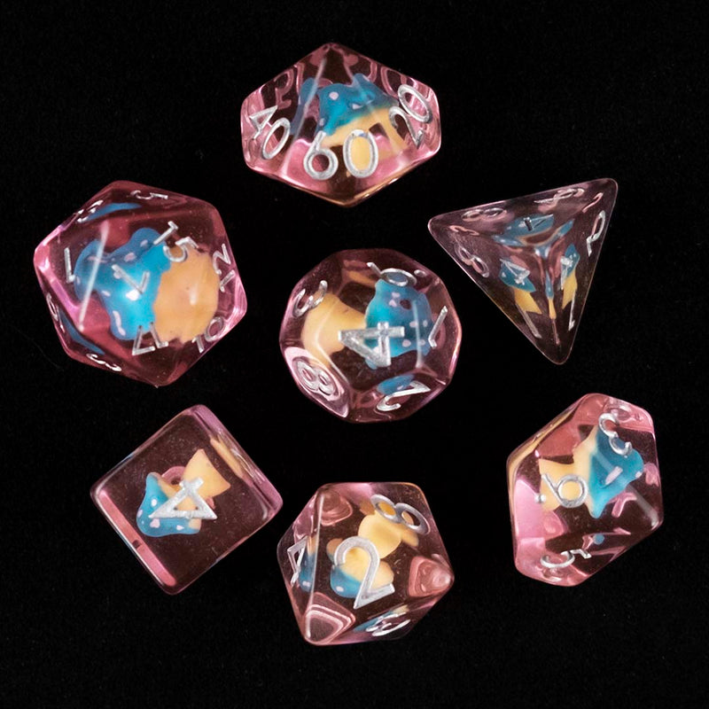 A set of pink polyhedral dice with blue and pink cap mushroom inclusions from above on a black background.