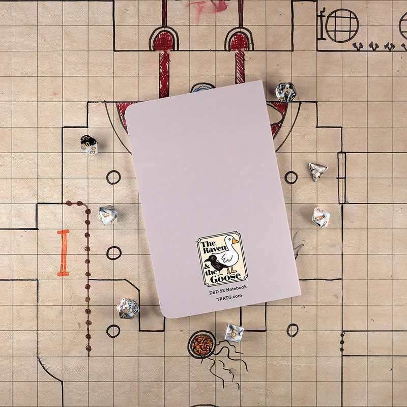 Back cover of a gray Dungeon Master notebook with "The Raven and the Goose" logo on the bottom on a grid map surrounded by dice.