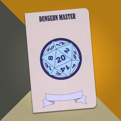 A large gray Dungeon Master notebook with an illustration of a blue 20 sided die on an orange, cream and grey background.