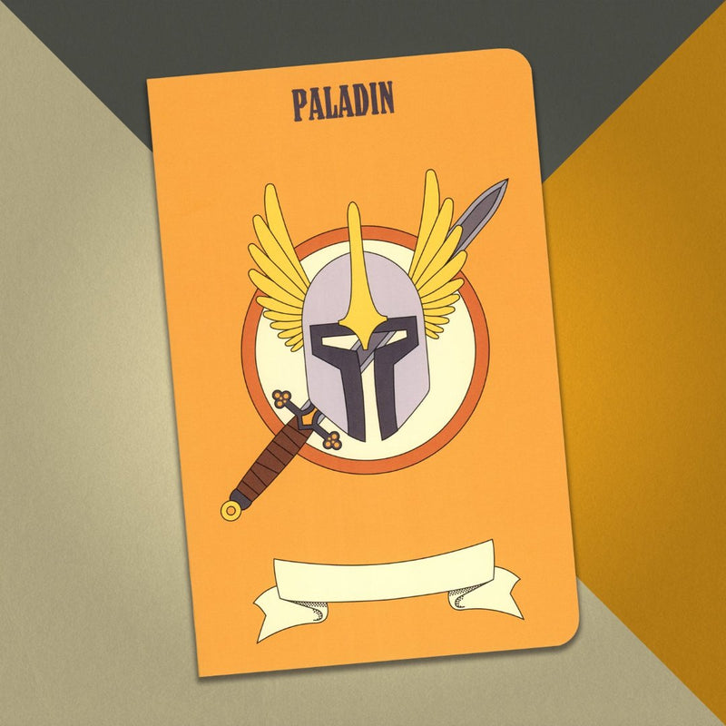 A large paladin notebook with an orange cover and an illustration of sword and a winged helm on an orange, cream and grey background.