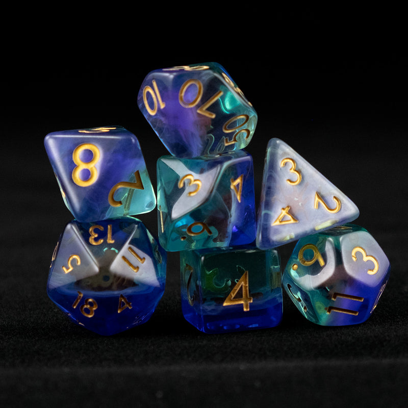 A set of clear green and blue polyhedral dice with red octopus inclusions on a black background.