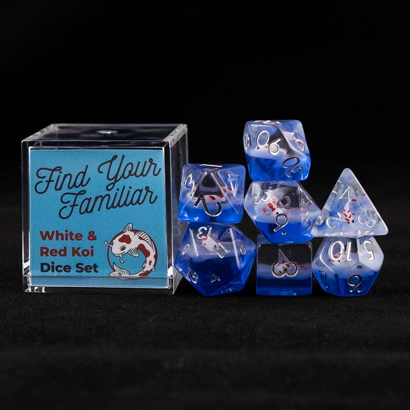 A set of clear and blue polyhedral dice with red and white koi inclusions sitting to the right of a small acrylic box with the words "Find Your Familiar" and "Red & White Koi Dice Set" on a black background.