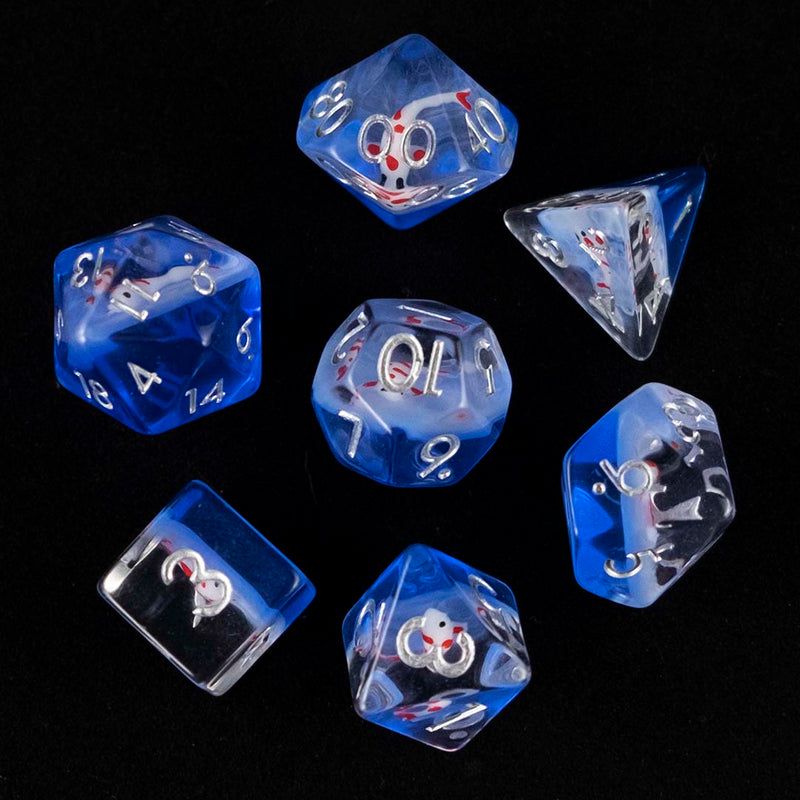 A set of clear and blue polyhedral dice with red and white koi inclusions from above on a black background.