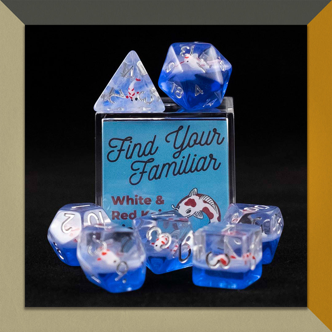 A set of clear and blue polyhedral dice with red and white koi inclusions sitting on top and around a small acrylic box with the words "Find Your Familiar" and "Red & White Koi Dice Set" on an orange, cream and grey background.